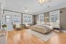 One of the Primary Bedroom Suites Virtually Staged