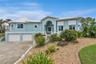 Set on over three-quarters of an acre with approximately 85 feet of ocean frontage, this property offers a generous setback from the road, ample drive