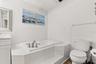 Master ensuite bathroom with updated finishes and statement window and skylight