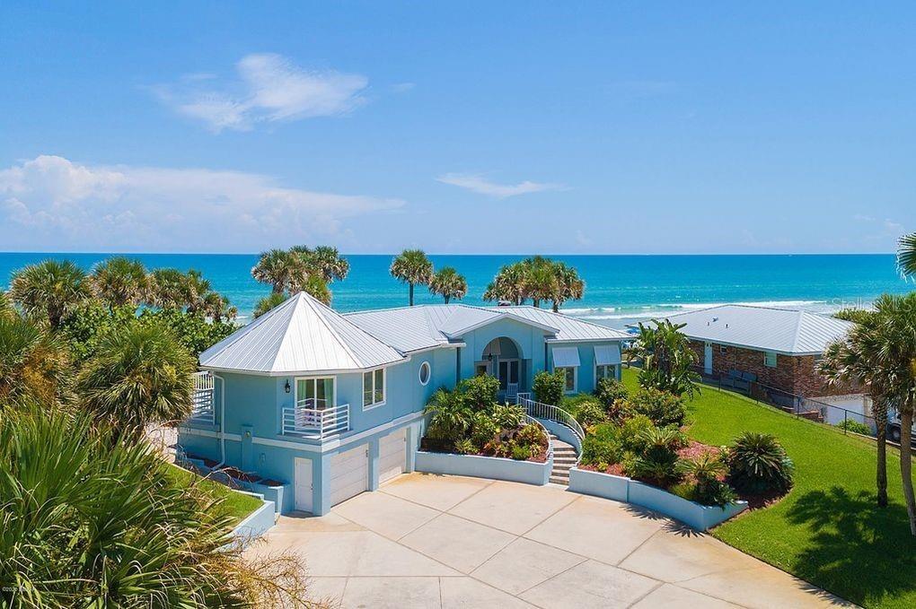 Set on over three-quarters of an acre with approximately 85 feet of ocean frontage, this property offers a generous setback from the road, ample drive
