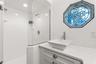 Master ensuite bathroom with updated finishes and statement window and skylight