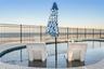 new poolNew oceanfront pool installed in 2024, featuring heating, a sun shelf, bubblers, and a 7-foot-deep end, with expansive patio space and panoram
