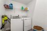 Main floor laundry room located at the entrance to the master bedroom suite and ensuite bathroom