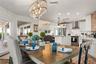 Sweeping Atlantic views take center stage in this bright family room, complemented by coastal furnishings and luxury vinyl plank flooring.