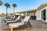 new poolNew oceanfront pool installed in 2024, featuring heating, a sun shelf, bubblers, and a 7-foot-deep end, with expansive patio space and panoram