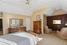 Primary Bedroom Is Open To Sitting Area With Custom Built-in. A Reading Retreat, Gym Or TV Area!