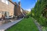 More Backyard With Privacy Shrubs & Stone Wall!
