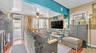 Wood-finish flooring, ceiling fan, and window-mounted air conditioning unit