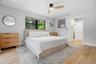 Primary Bedroom with Electronic Blinds & Extra window AC for those who like it extra cold at night!