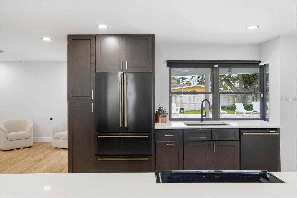 Pantry Cabinets with Pull-out Shelving, Forno Appliances, Fridge with Ice Maker