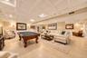 Recessed lighting, light wood-finish flooring, white coffered ceiling, wainscoting, and double French doors