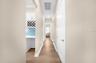 Hall going to garage, laundry room and the third bedroom