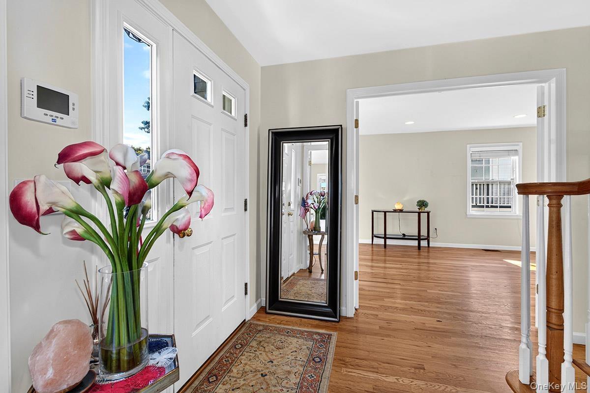 Entry opens to the living room & family room