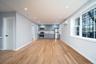 Unfurnished living room featuring recessed lighting, light wood-style floors, and a wall mounted air conditioner
