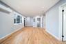 Unfurnished living room featuring a wall mounted AC, light wood-type flooring, recessed lighting, and electric panel