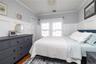 Bedroom w/ Detailed Moulding