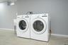 Laundry room featuring baseboards and separate washer and dryer