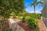 Lush tropical landscaping creates a private, resort-inspired atmosphere.