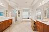 Individual vanity areas provide convenience and personal space.