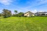Dedicated landscape lighting highlights the property's outdoor features.