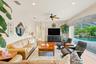 Spacious family room connects seamlessly with the kitchen and outdoor living areas.