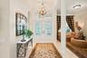 Welcoming entrance introduces the home's impressive scale and custom design.