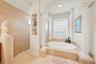 Relaxing soaking tub creates a comfortable retreat within the primary bath.