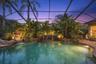 Color-changing pool lights enhance the outdoor setting after sunset.