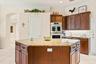Abundant cabinetry provides excellent storage and workspace.