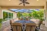 Covered outdoor area provides a comfortable setting for dining and relaxing