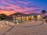 RearExterior_2903rdStreet_BonitaSprings_ScreenEnclosure_Twilight.jpg