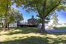 Established shade trees and green space provide an inviting outdoor setting to enjoy.