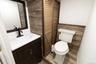 An additional bathroom featuring classic fixtures and finishes to compliment any style.