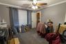 This flexible bedroom space offers multiple possible uses for a variety of house