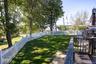 Enjoy the tree lined outdoor area with fencing and well established greenery.
