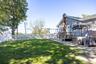 Relax in this peaceful outdoor setting with mature trees and access to the deck and surrounding areas.