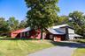 Exterior view of the barn and surrounding landscaping.