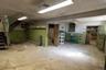 Versatile utility or workshop space within the barn with overhead lighting.
