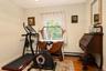 Hardwood flooring, painted walls, window with trim, and recessed ceiling light