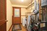 Utility room with access to the rear covered patio and rear yard