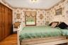 Hardwood flooring with a satin finish, dual windows and large closet with 6 panel wood doors