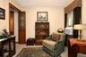 L shaped office with entrance to primary bedroom