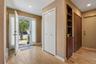 Powder room and large coat closet upon entry