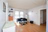 Wood-finish flooring with white baseboards