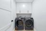 Laundry Room with storage cabinets