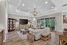 Great Room w/Tray Ceiling and Extensive Crown Molding