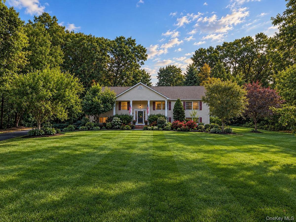 Expansive front lawn with mature trees and established landscaping