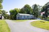 The view towards the residence along the driveway that leads to both the residence and the barn.