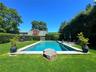 View of pool with a yard and a patio