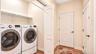 Hall Laundry, located off garage and basement entrance